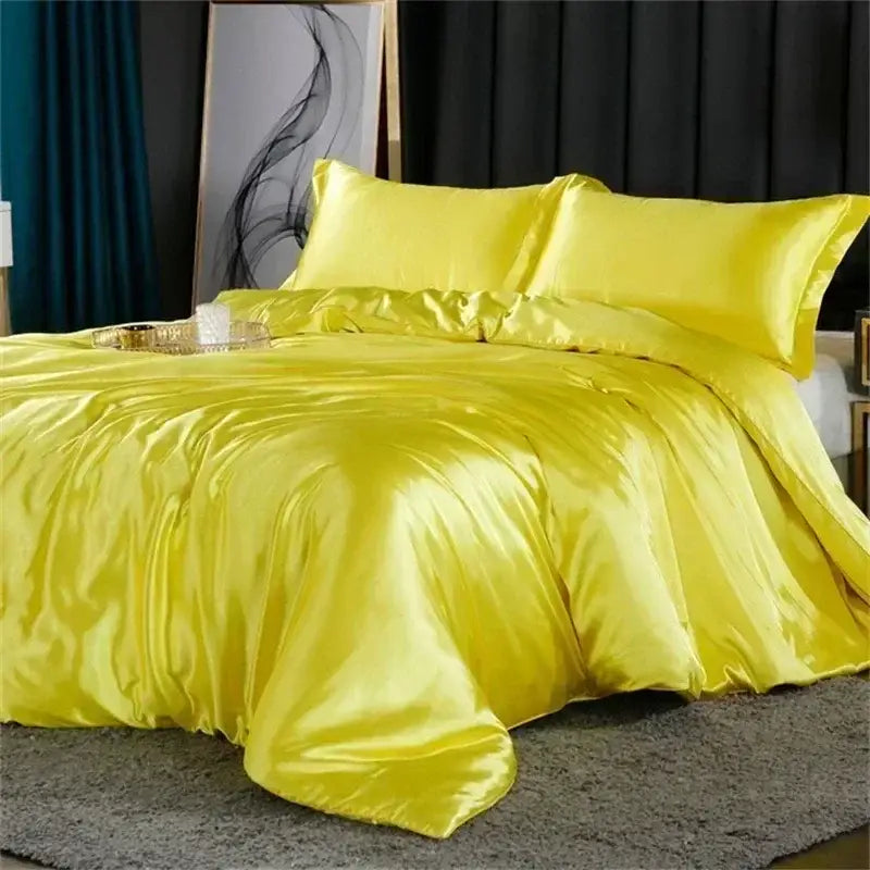 Vibrant yellow satin duvet cover and matching pillows in the decorbites luxury silk bedding set with fitted sheet