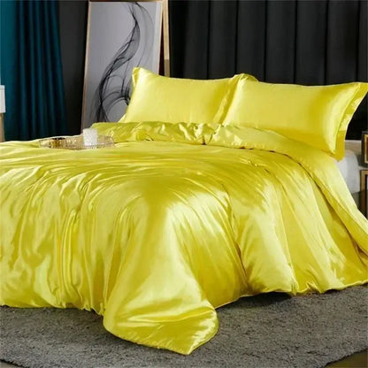 Vibrant yellow satin duvet cover and matching pillows in the decorbites luxury silk bedding set with fitted sheet