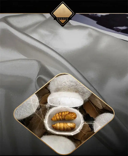 A white ceramic bowl with golden-brown silkworms and silk cocoons highlighting the silk material in decorbites luxury bedding set fitted sheet and duvet cover