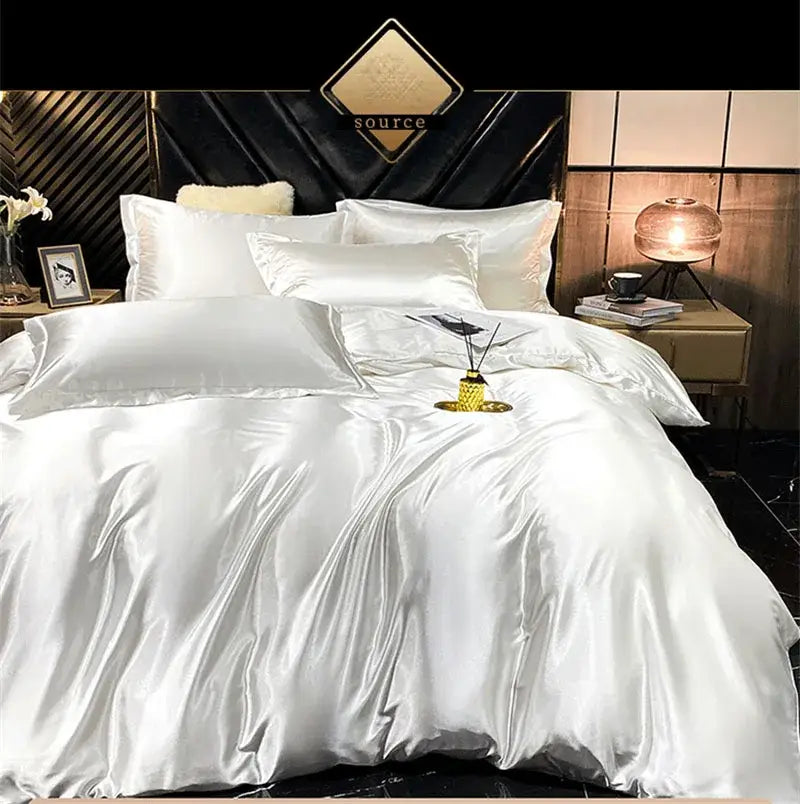 White satin bedding set with glossy finish featuring a fitted sheet and duvet cover from DecorBites™ Luxury Silk Bedding Set