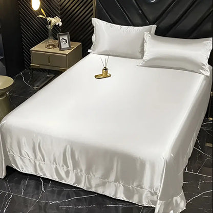 DecorBites™ luxury silk bedding set featuring a white satin fitted sheet with subtle sheen and ruffled hem