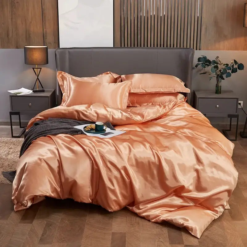 Glossy peach satin pcduvet cover set with matching pillowcases and dark gray throw blanket for width bed solid color use
