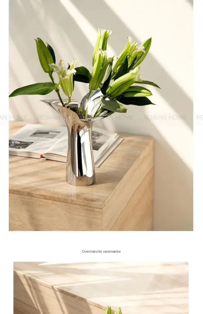 DecorBites™ luxury stainless steel vase in silver metallic with sleek modern design holding fresh green lilies
