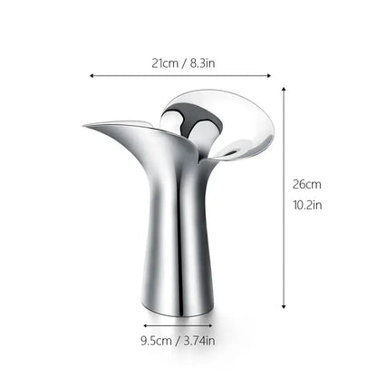 A sleek silver-toned luxury stainless steel vase with a modern sculptural design for home decor by decorbites
