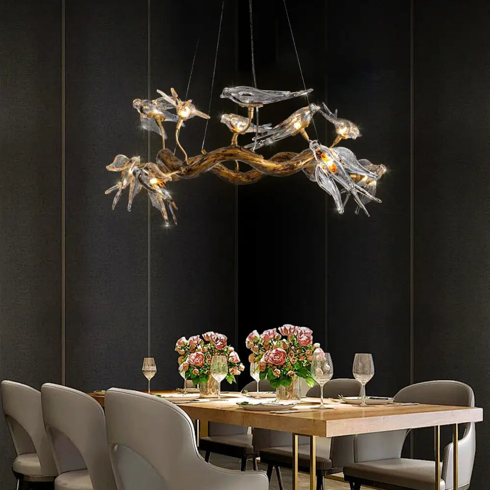 DecorBites luxury vintage glass bird chandelier with golden-brown branch and illuminated translucent glass birds