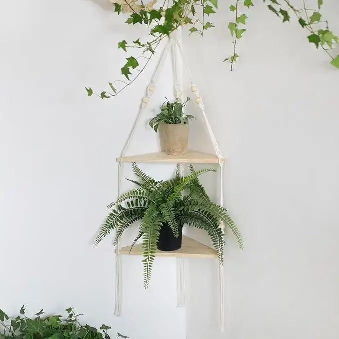 DecorBites macrame wall hanging corner shelf with two light wood tiers and white cord holding green plants