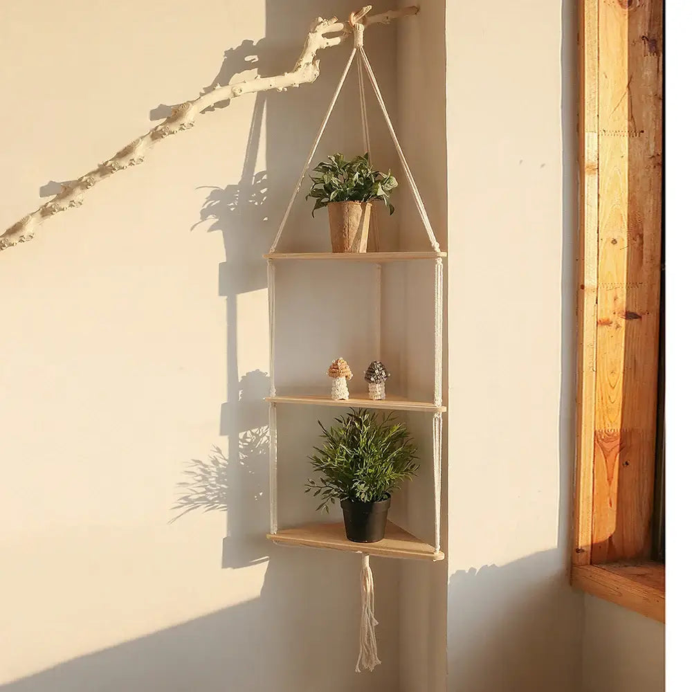Beige DecorBites™ macrame wall hanging corner shelf with three wooden tiers and tassel for boho decor