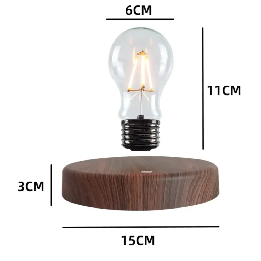 Decorbites magnetic levitation lamp with a clear glass edison-style bulb and black base floating above wooden platform