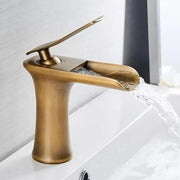 Antique brass decorbites™ mai single handle gold bathroom faucet with waterfall design and integrated water feature