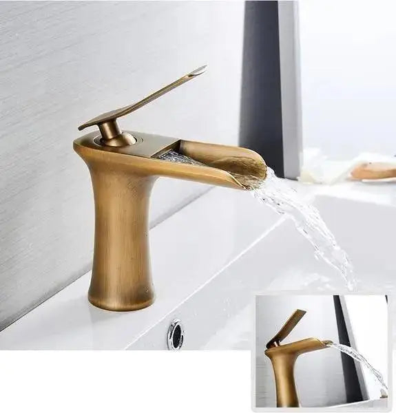 DecorBites Mai antique brass gold bathroom faucet with single handle and sleek curved waterfall spout design