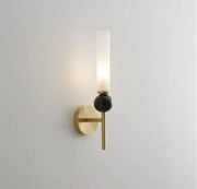 Gold-toned decorbites marble sconce wall light with frosted glass cylinder and matte black spherical accent