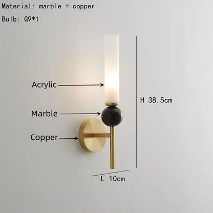 A modern decorbites marble sconce wall light with brass copper base, black marble sphere, and warm acrylic diffuser lighting