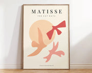 A minimalist framed DecorBites™ matisse floral art print with abstract flowers in peach and coral on cream background