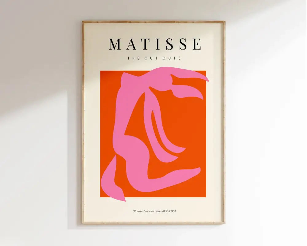 A framed DecorBites™ Matisse floral art print featuring a bold pink silhouette from the market Matisse collection