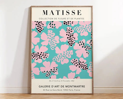 A framed matisse floral art print with vibrant turquoise background and pink polka dot flowers for wall decor