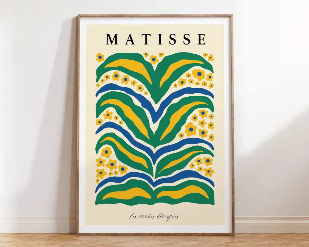 A framed decorbites™ matisse floral art print with bold green yellow and blue abstract floral patterns