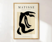 Minimalist framed decorbites matisse floral art print featuring a black silhouette and abstract flowers matisse text