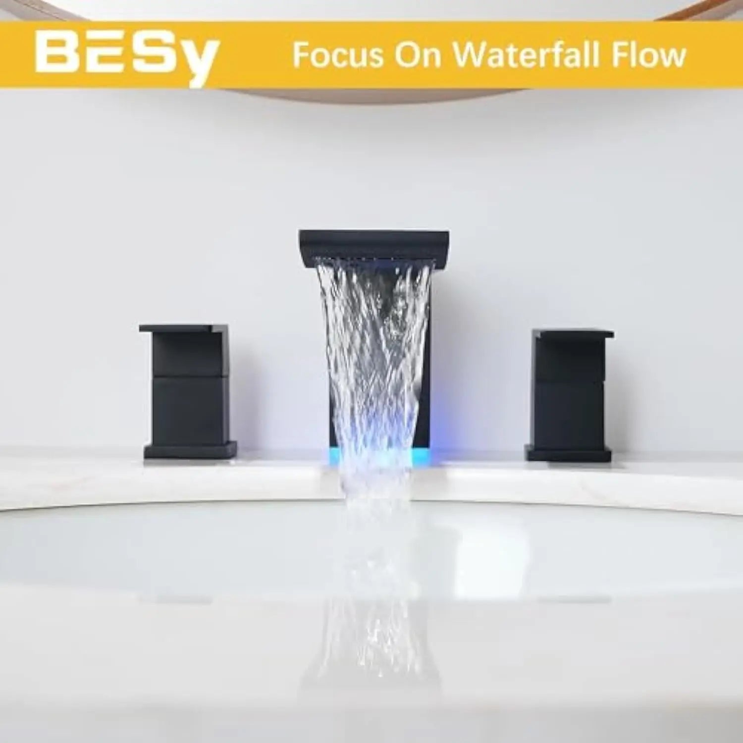 DecorBites™ matte black bathroom faucet with LED waterfall spout and illuminated blue sink faucet lighting