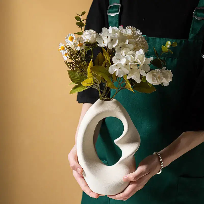 Decorbites matte ceramic vase set 2 features a sleek off-white matte vase set with modern abstract swirl design for home decor