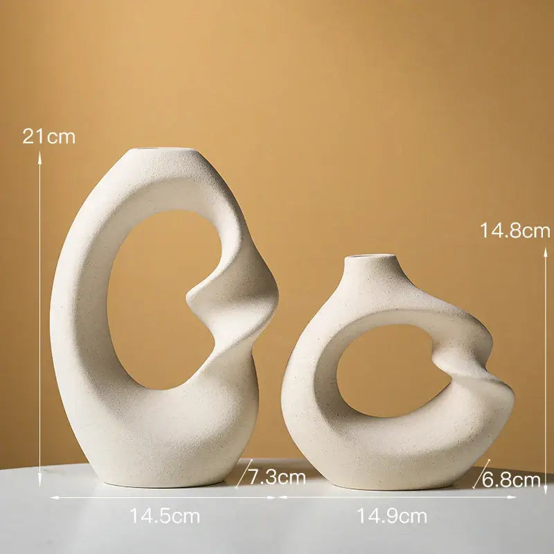 Two off-white matte ceramic vases with organic flowing forms in the decorbites matte vase set for modern home decor