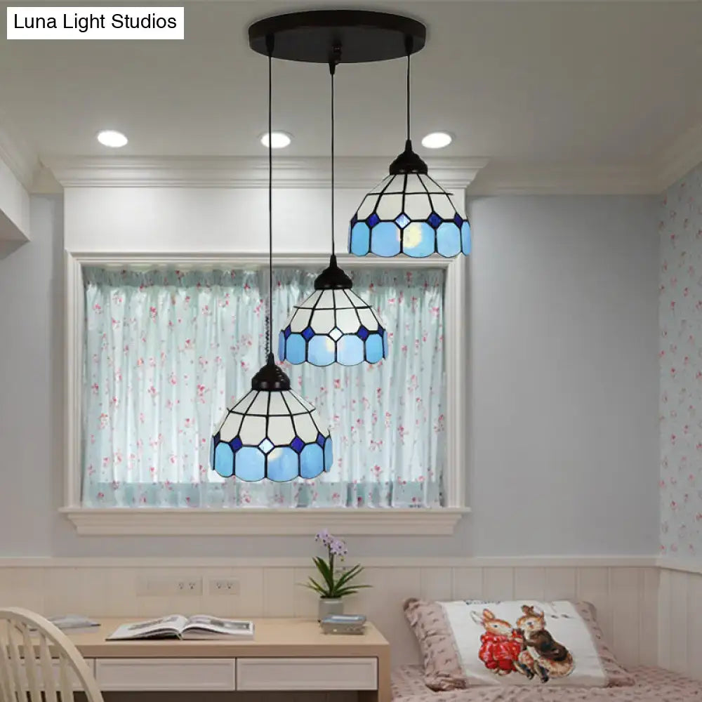 Set of three blue and white mediterranean cut glass bowl hanging light fixtures with black metal frames for bedrooms