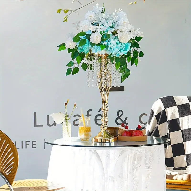 Elegant gold-toned metal flower vase chandelier centerpiece with cascading white and light blue silk flowers for weddings