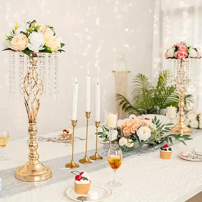 Gold-colored crystal-adorned tall metal flower vase from decorbites for wedding centerpieces with floral arrangement on top