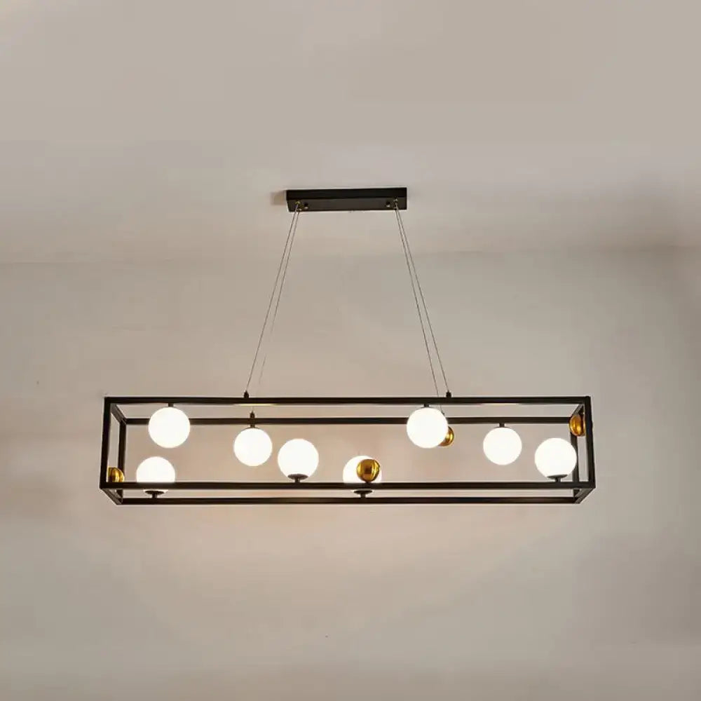 DecorBites™ black metal rectangular pendant light with seven frosted milk glass shades and gold accents for industrial dining