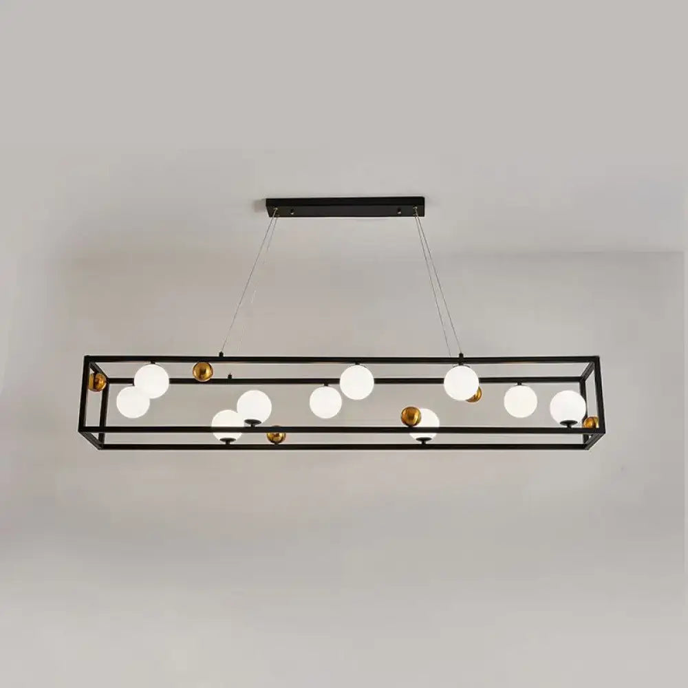 Black metal rectangular chandelier with gold-toned accents and milk glass shade for industrial dining rooms