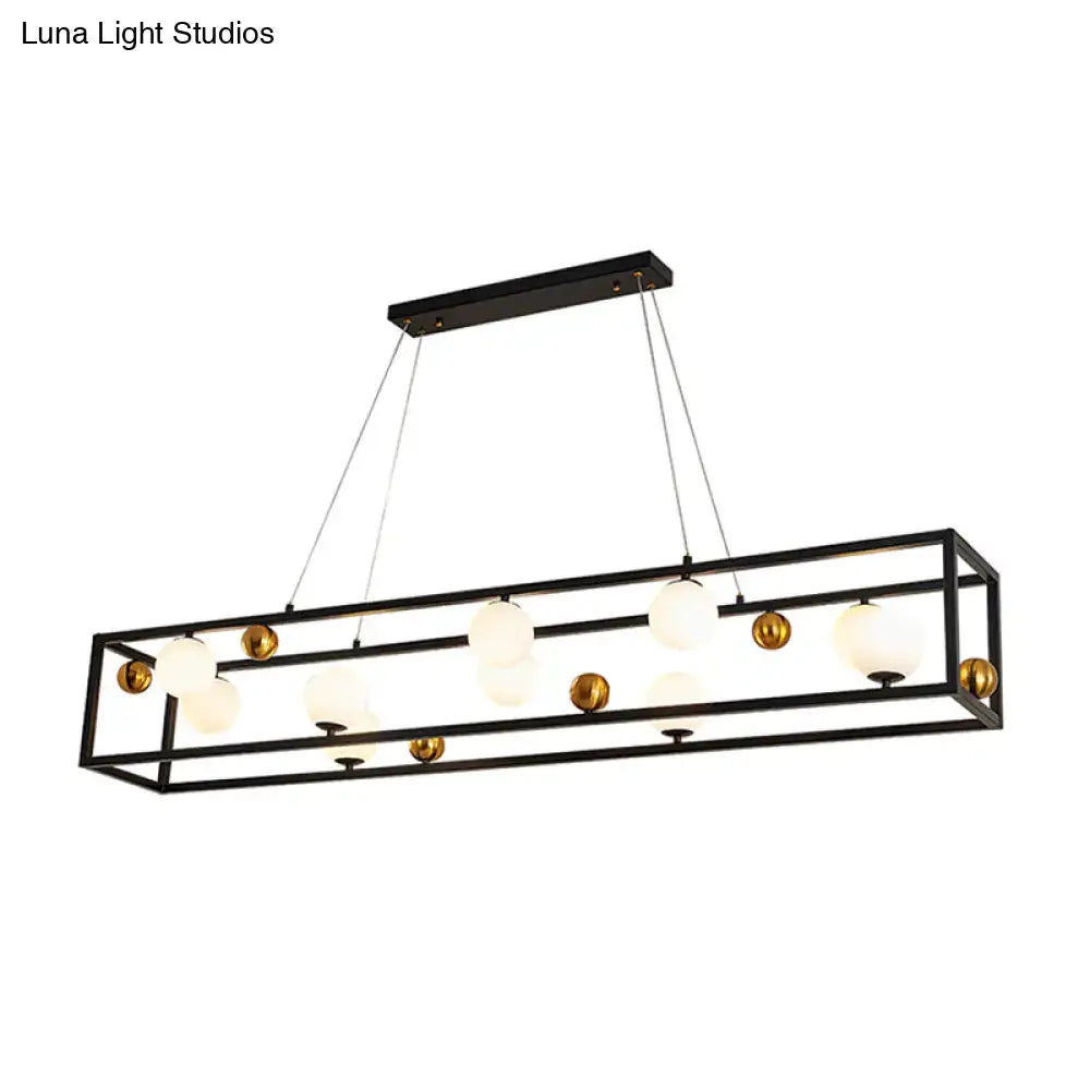 Black metal rectangular chandelier with gold spherical accents and milk glass shade for industrial dining rooms