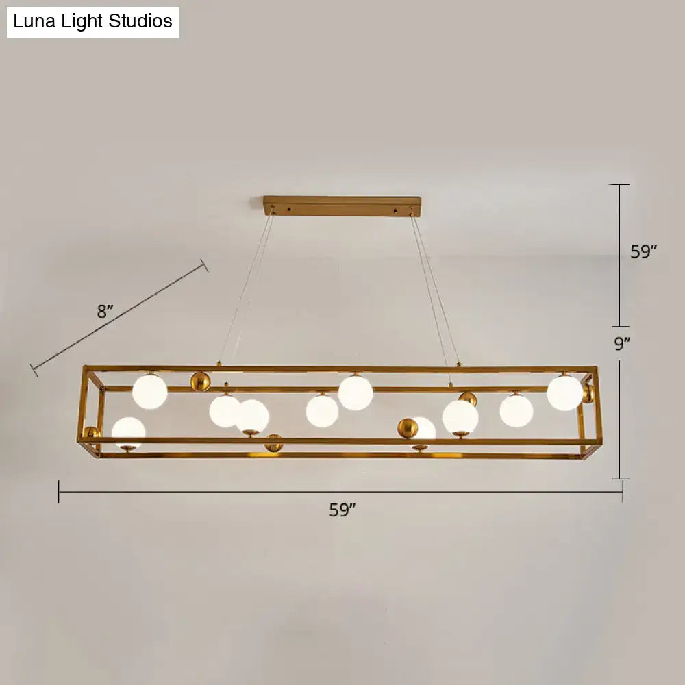 Gold-toned decorbites metal pendant light with milk glass shade featuring spherical bulbs for industrial dining rooms