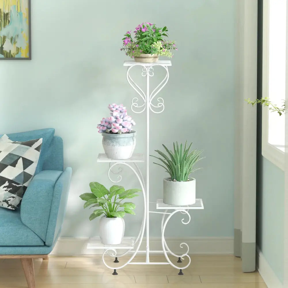 White wrought iron metal plant stand with ornate scrollwork and four tiered shelves for 4 flower pots by decorbites