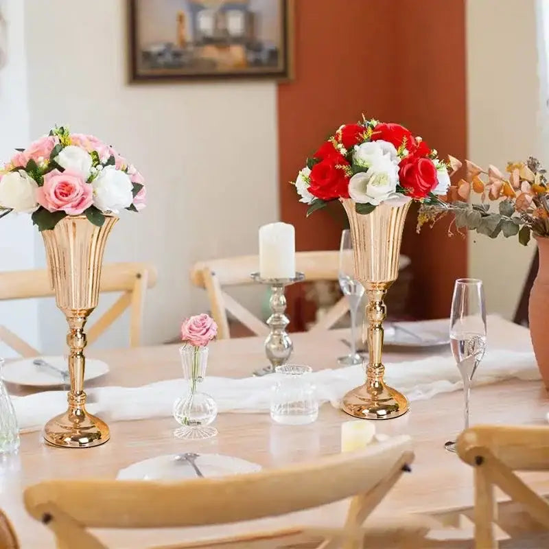 Golden fluted metal trumpet vase holding a bouquet of red and white roses decorbites wedding centerpiece decor