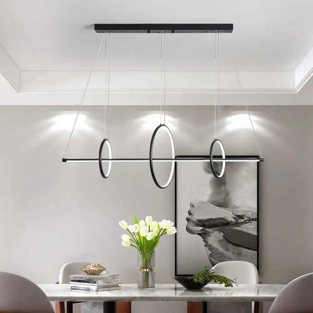 DecorBites™ black metallic circle and line LED pendant light with three rings features adjustable fixture height and 110v-120v