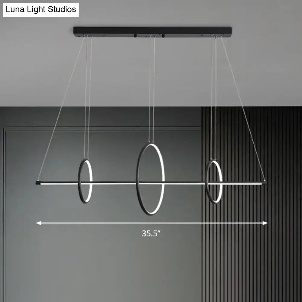 Modern black and white circular pendant light fixture with three glowing rings and sleek bar, suitable for 220v-240v use