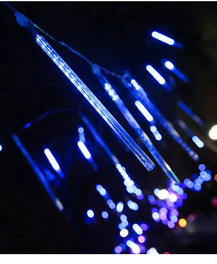 Decorbites meteor shower led string lights with blue clear plastic strands resembling falling meteors for outdoor decor