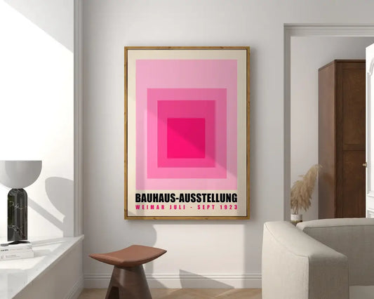 Decorbites™ mid century geometric canvas print art featuring concentric pink squares and black bauhaus text in wood frame