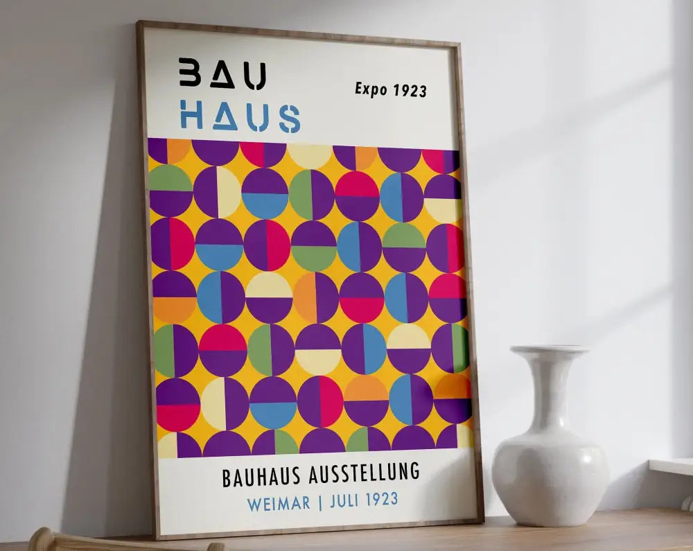 A framed bauhaus canvas print with vibrant overlapping colored circles in yellow purple pink blue and green for mid century home decor