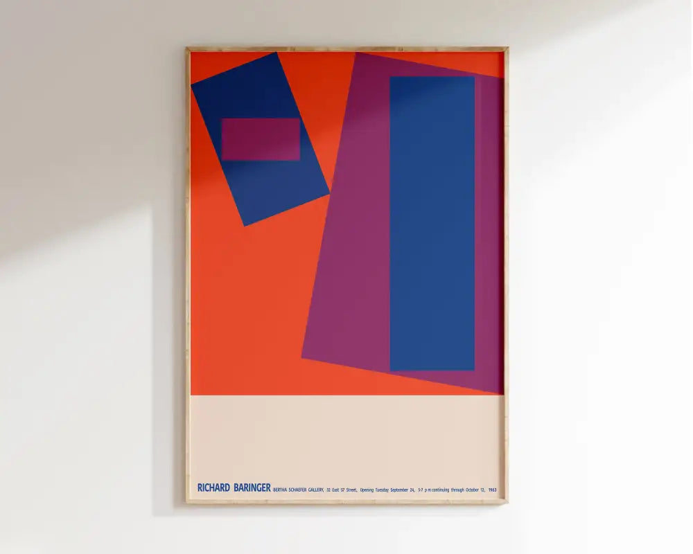 A framed mid century canvas print with bold geometric shapes in orange blue and magenta for home decor