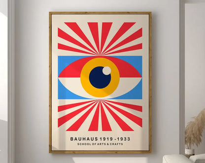 A framed decorbites™ mid century geometric wall art print featuring a bold eye design with red blue and yellow rays