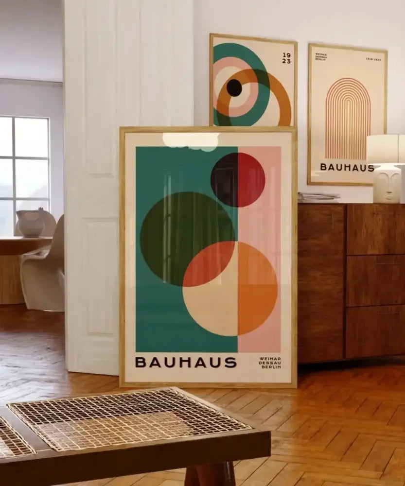A framed decorbites™ mid century modern wall art featuring bold geometric teal green red and orange circles on pink cream