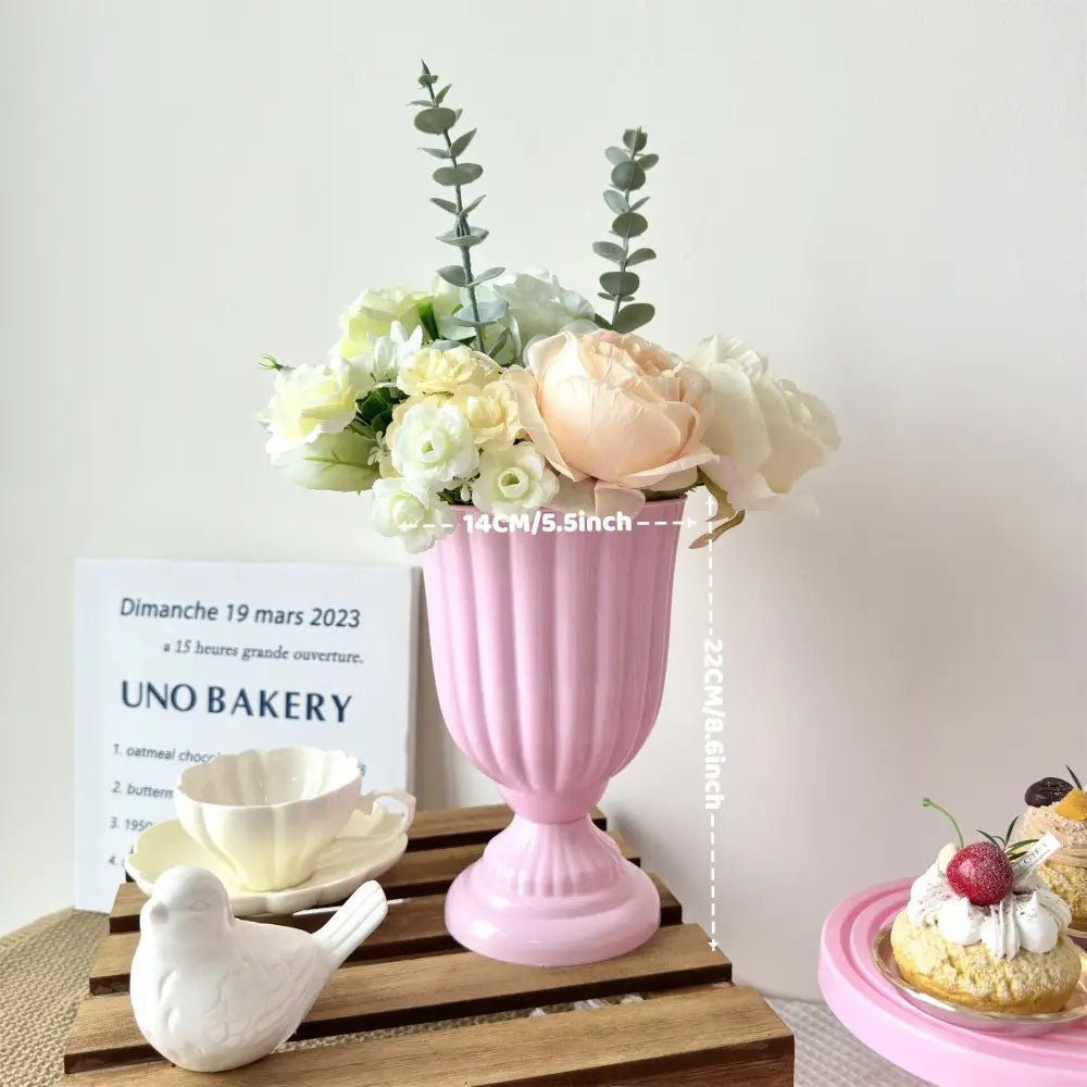Pink ceramic DecorBites™ mini flower arrangement vase with vertical fluting and pedestal base for home decor