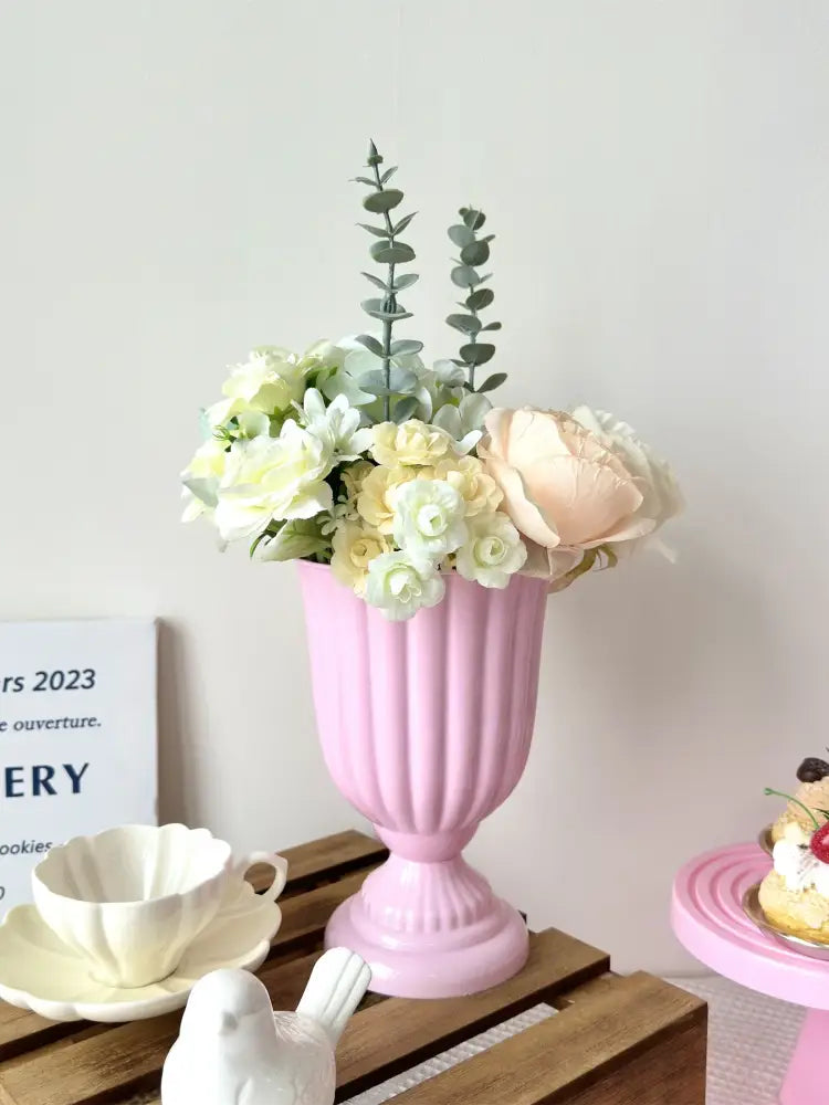 DecorBites™ mini flower arrangement in a pink ribbed ceramic vase with soft white and peach artificial flowers
