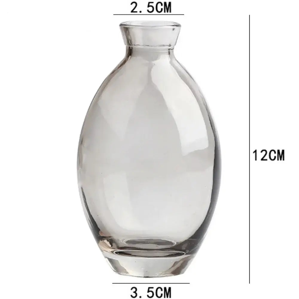 DecorBites™ mini glass flower vase with clear rounded body narrow neck and flat base for home decor