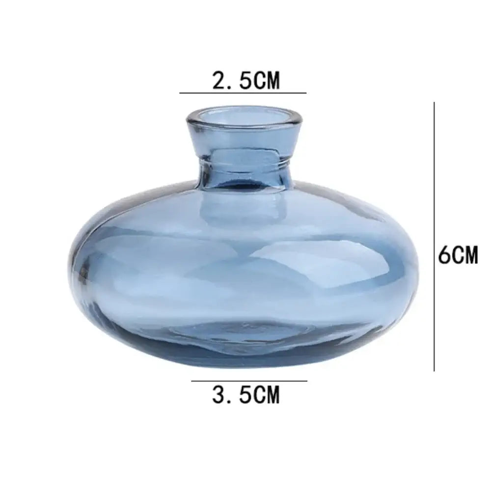DecorBites™ mini glass flower vase in translucent blue with a rounded bulbous body and short neck for home decor