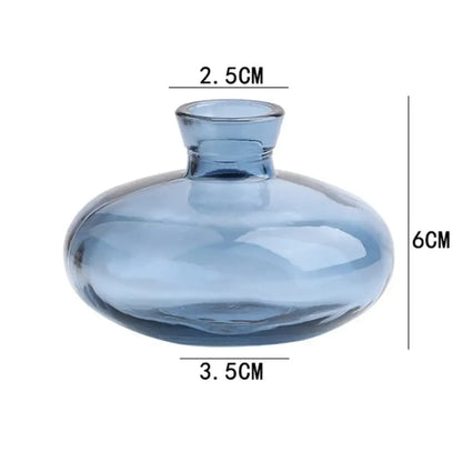 DecorBites™ mini glass flower vase in translucent blue with a rounded bulbous body and short neck for home decor