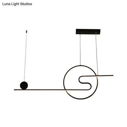 Black minimalist acrylic island light with warm white light featuring geometric sun and cloud design in black white gold