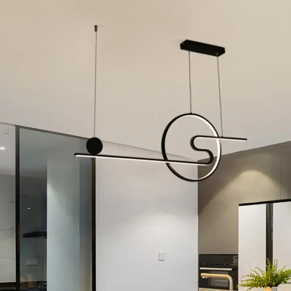 Modern black and silver geometric pendant island light with warm white light and black white gold accents by decorbites