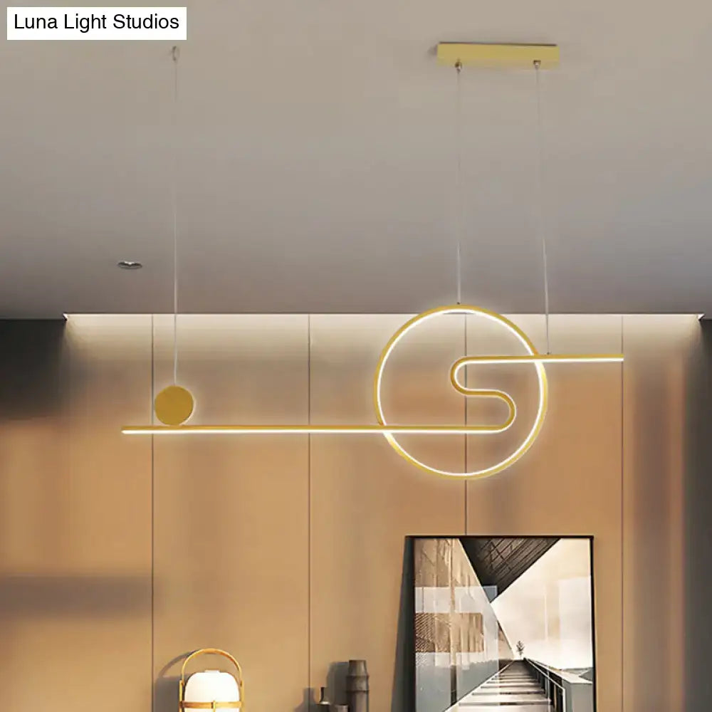Modern gold-toned led island light with sleek geometric design featuring warm white light and black white gold accents