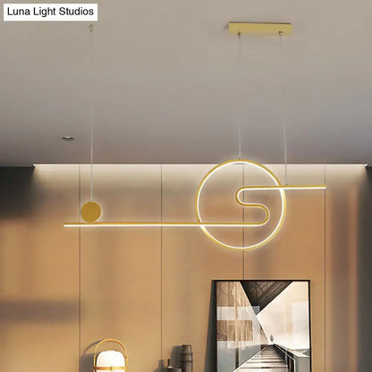 Modern gold-toned led island light with sleek geometric design featuring warm white light and black white gold accents